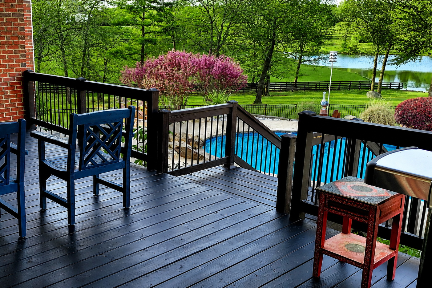 Covered porch overlooking pond and backyard